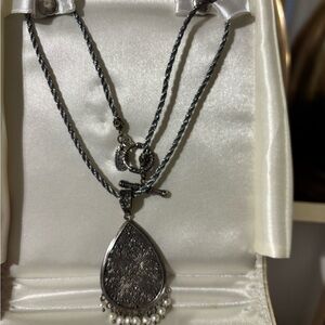 Elegant Silver Pendant Necklace with Intricate Design antique